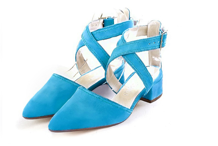 Turquoise blue women's open back shoes, with crossed straps. Tapered toe. Low flare heels. Front view - Florence KOOIJMAN